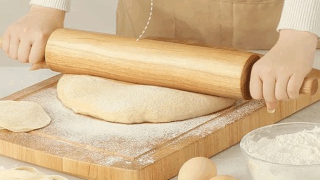Bhature dough rolled out in rounded shape before frying at zaikastreet