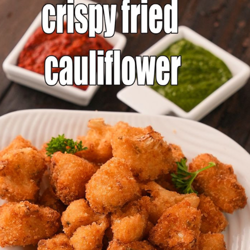 Gobi Manchurian Recipe | crispy & saucy restaurant style crispy fried cauliflower florets placed on tissues to absorb oil at zaikastreet restaurant