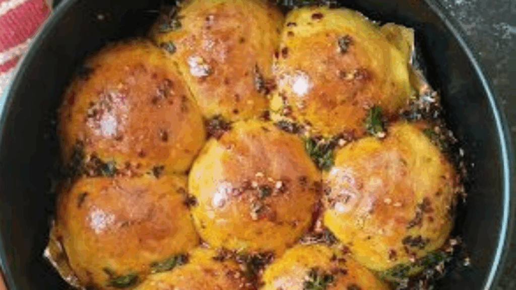 golden brown pav buns in kadai at zaikastreet