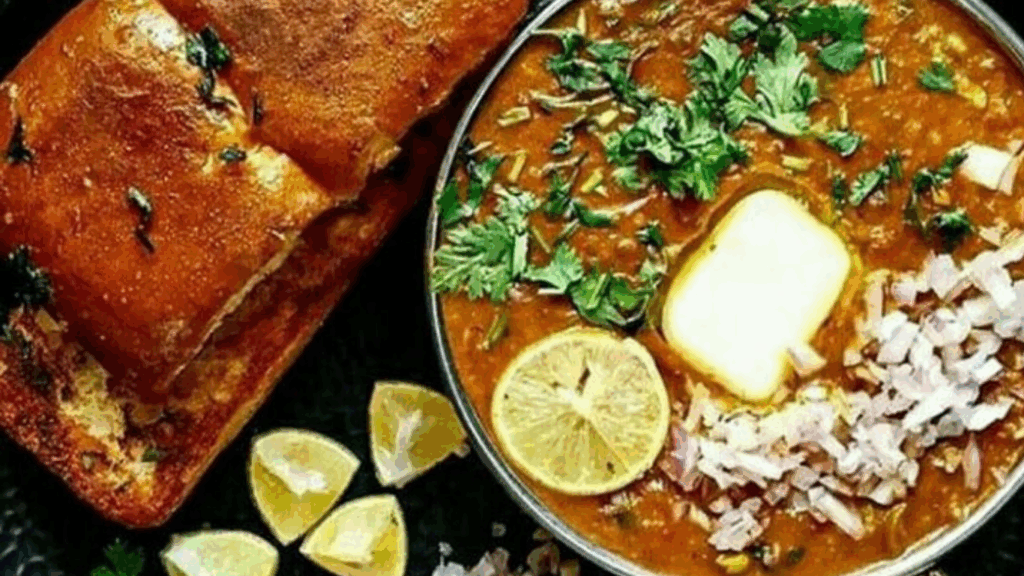the pav bhaji served with butter pav, chopped onion and lemon wedge at zaikstreet delhi