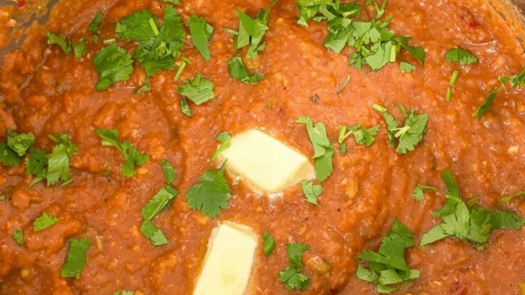 melting butter and garnishing pav bhaji with coriander at zaikastreet